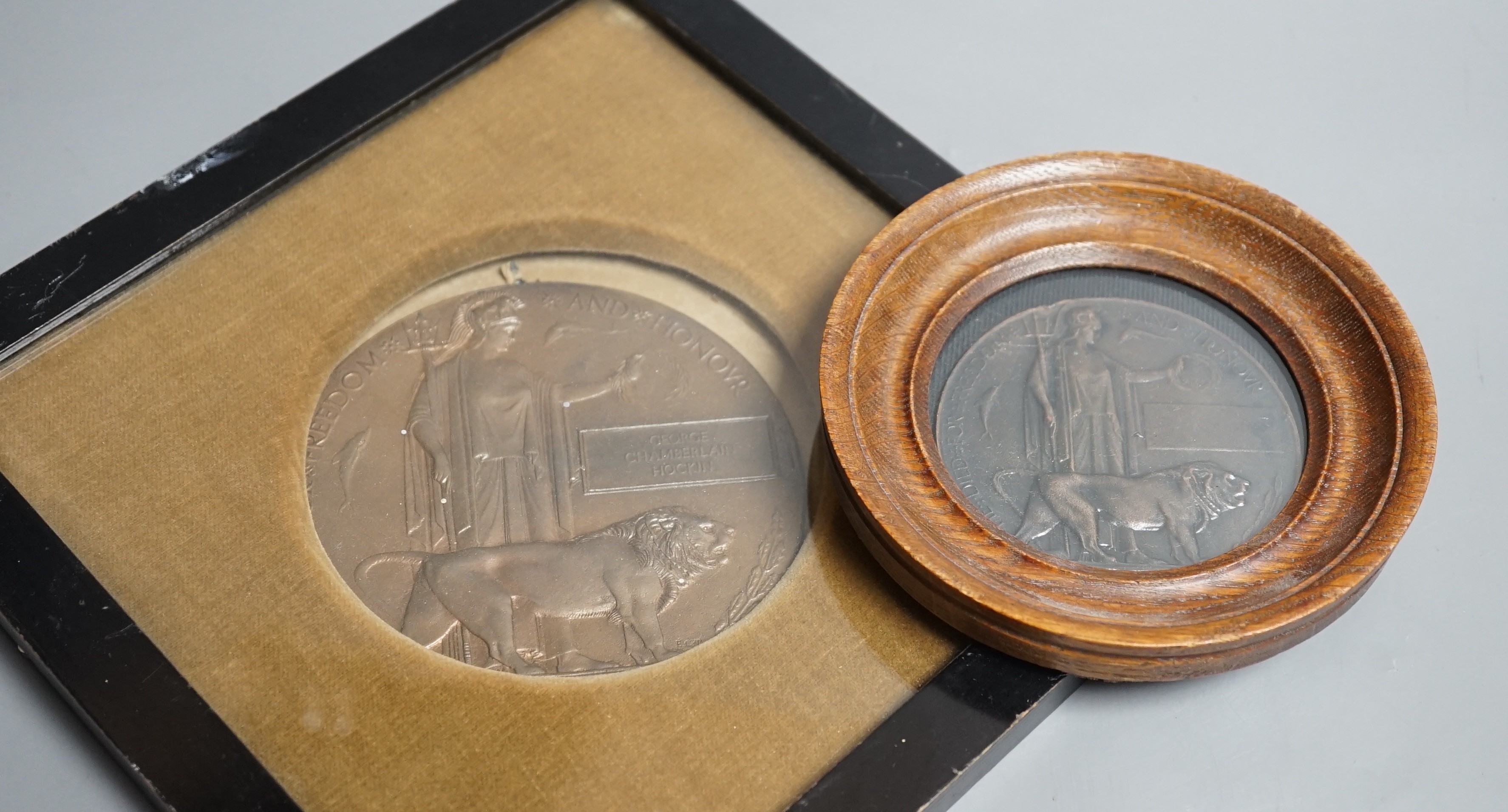 A framed WWI bronze death plaque to George Chamberlain Hockin, Lieutenant George Chamberlain Hockin of 7th Gurkha Rifles, aged 23 years killed in action at Ctesiphon, Mesopotamia, Nov. 23rd 1915, 11 cms diameter, and a r